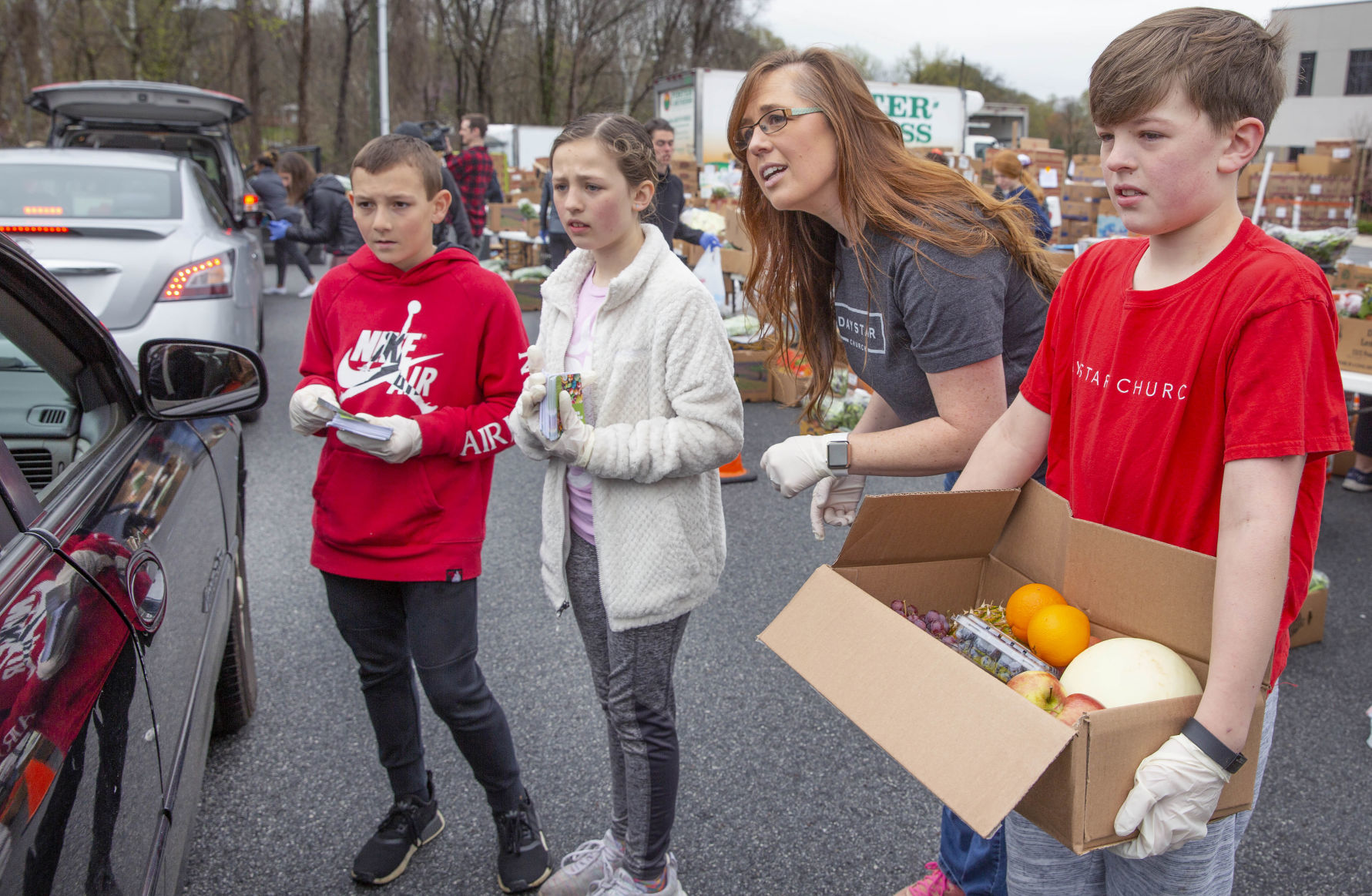 Crowds flock to produce giveaway at Daystar Church